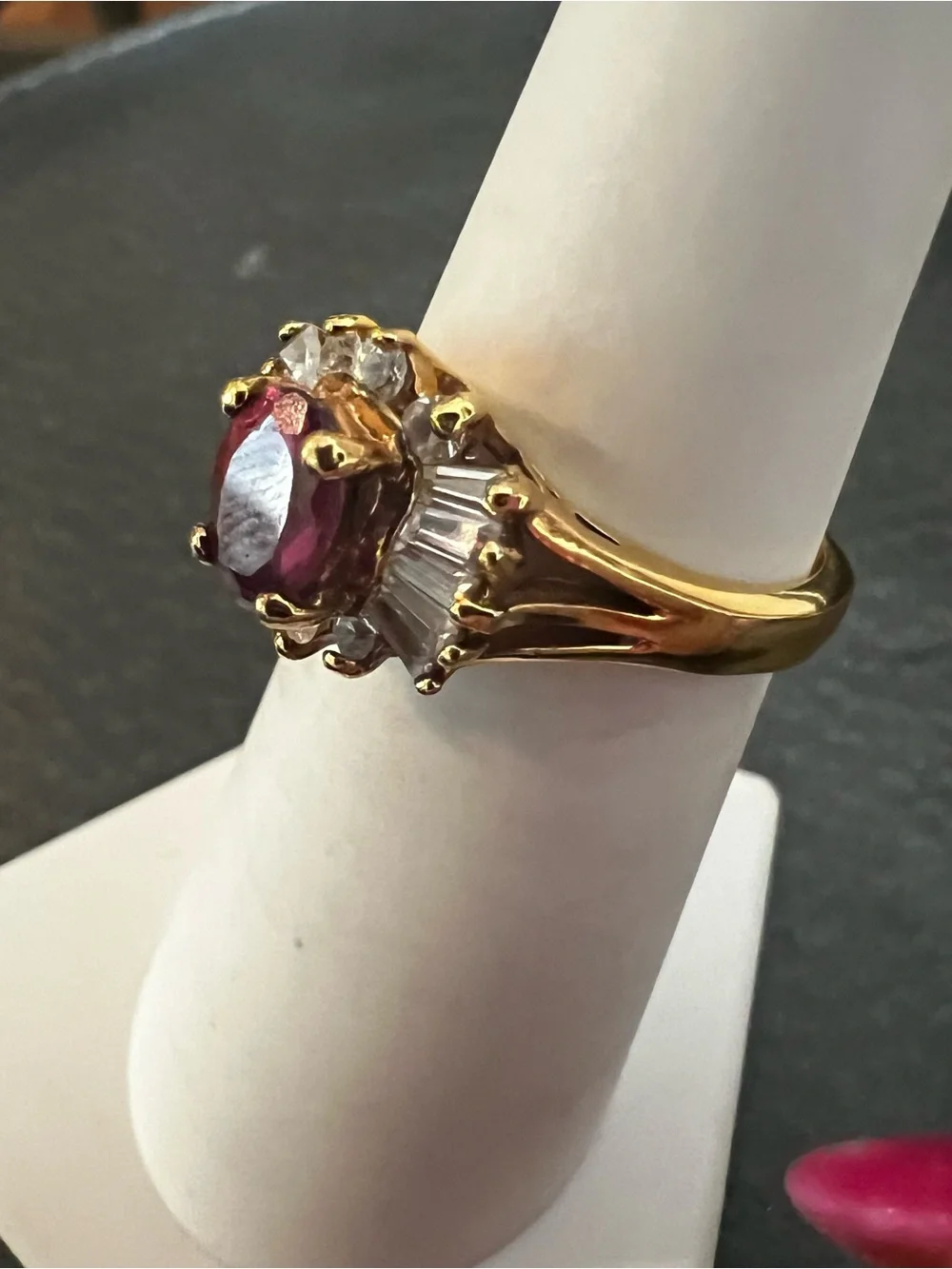 Gold Ring with Ruby-Red Center and Clear Accent Stones